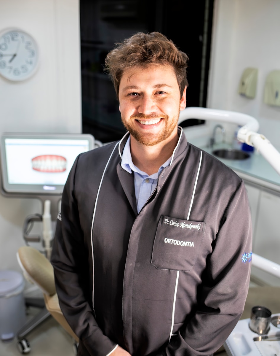 a man with dental insurance smiling for the camera 